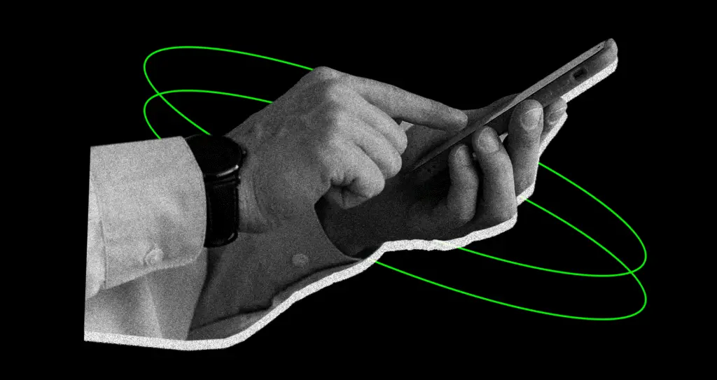 Hand holding a smartphone displaying cybersecurity tips for staying safe online